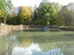 Surrounded by nature, the pond of Labotect with a blue duck house with Labotect's inscription.